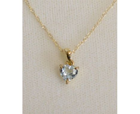A 10 ct. Gold and Aquamarine Pendant with linked chain 