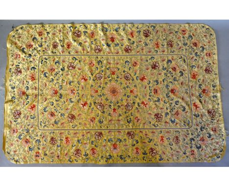 An Early Chinese Silk Work Embroidered Panel with foliate scrolls upon a yellow ground, 171 cm by 110 cm 