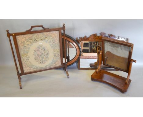 A Chippendale Style Rectangular Wall Mirror with carved, shaped cresting, together with an oval wall mirror, a swing frame to