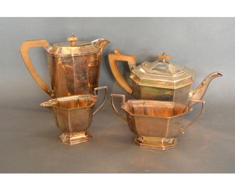 An Art Deco Silver Four Piece Tea Service, comprising tea pot, hot water pot, cream jug and two handled sucrier, London 1933,