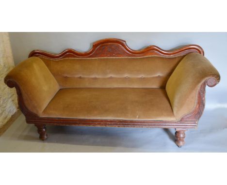 A Victorian Mahogany Scroll End Sofa with a shaped and button upholstered back raised upon turned legs, 183 cms wide 