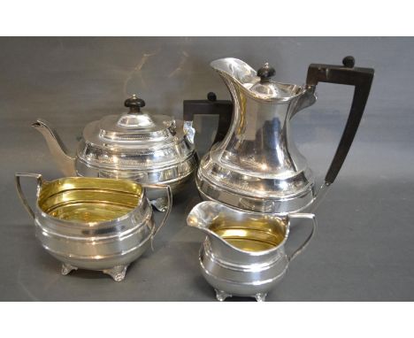 A Sheffield Silver Four Piece Tea Service comprising teapot, hot water pot, two handled sucrier and cream jug, 62 ozs. all in