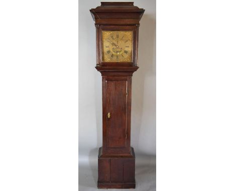 A George III Oak Long Case Clock the Pagoda Hood with turned pilasters, above a rectangular panel door and conforming plinth 