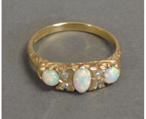 A 9 ct. Gold, Opal And Diamond Ring, set with three opals inter-spaced with diamonds 