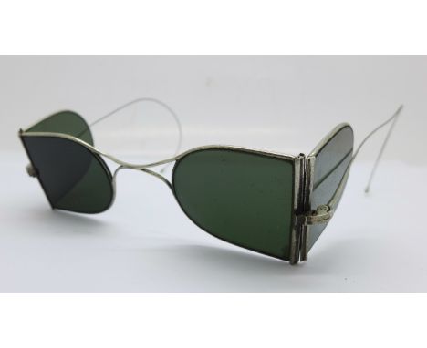 A vintage pair of hinged sunglasses, with case marked Gaupp &amp; Co., Hong Kong 