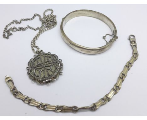 A mounted coin on a silver chain, a silver bracelet and a silver bangle, (bangle a/f) 