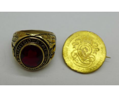 A 10k gold metal filled ring marked United States Army and a gilt coloured coin with pin, ring size M 