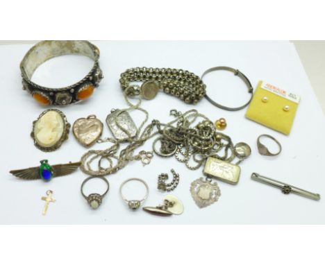 A collection of jewellery, a bracelet, bangle, silver chains, lockets, a winged brooch, and one 9ct gold stud, 0.5g, etc. 