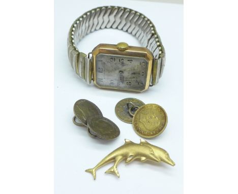 A Swan Art Deco 9ct gold wristwatch, London 1938, 25mm case, a 9ct gold dolphin brooch, 1g,  and a pair of silver coin cuffli