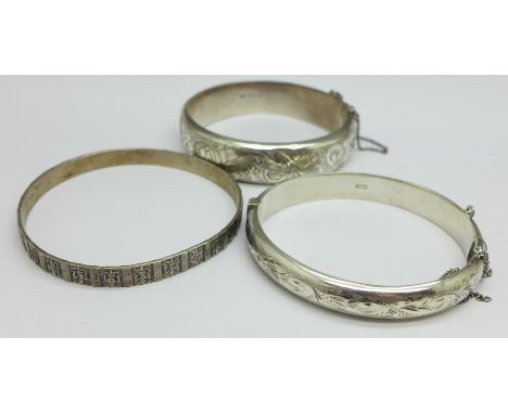 Two hallmarked silver bangles, one a/f, dented, and one other sterling bangle marked Danecraft, 56g 