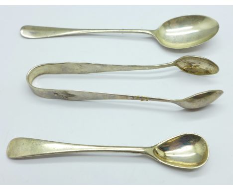 A pair of silver sugar bows, a rat tail silver spoon and a silver mustard spoon, 38g 