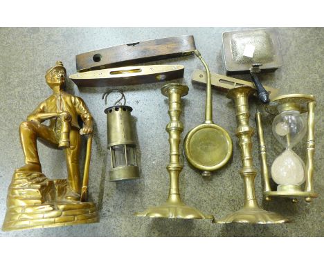 Assorted items:- pair of brass candle sticks, an oil can, plated roaster, egg timer, brass model of a miner and small miner's