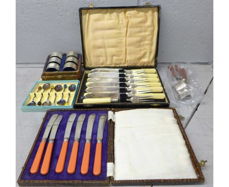 A boxed set of six silver plated napkin rings, box a/f, a cased set of fish knives and forks in a lacqured box, other flatwar