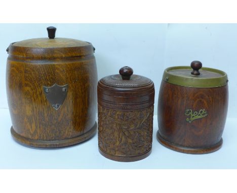 Two wooden tobacco jars and a wooden tea caddy 
