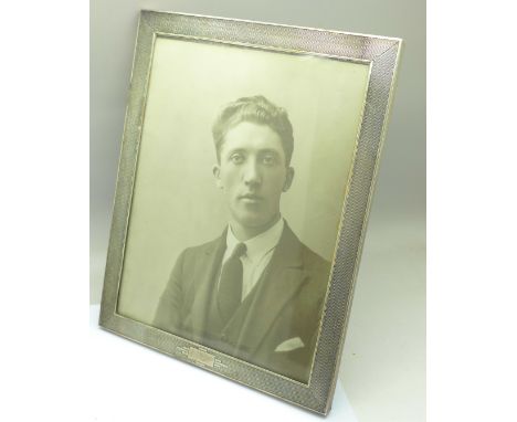 A silver Art Deco engine turned photograph frame, 19cm x 24cm 