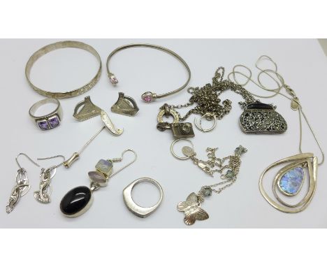 A collection of silver jewellery including bangles, pendants, rings, a marcasite pendant and chain and a pair of harp earring