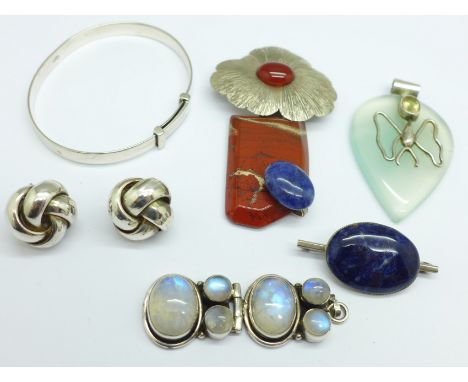 A stone set brooch/pendant marked Dana, two pendants, a brooch, a pair of earrings and a bangle 