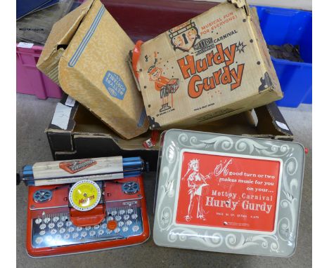 A Mettoy portable typewriter and music box 
