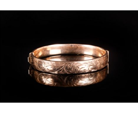 Rolled Gold 1/5 9ct Hinged Bangle The Front With Engraved Scroll Decoration Fully Marked, Weight 15 Grams