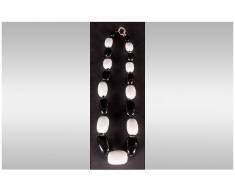 Monochrome Agate Large Stone Necklace comprising alternate, graduated, whlte and black agate, cuboid stones, fastened with a 