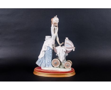Lladro Figure ' Baby's Outing ' Model Num.4938. Issued 1976. Height 12.5 Inches with Stand. Crack to Base Area of Figure.  
