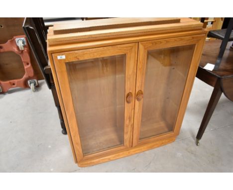A modern Ercol bookcase, approx. Width 91cm
Very few light marks and scuffs, frames seem sound with no visible worm