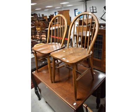 A pair of vintage Ercol (290) hoop and stick back kitchen chairs
&nbsp;
Few marks and scuffs, frames seem sound with no visib