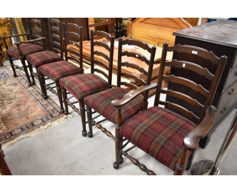 A set of six (four plus two) ladder back dining chairs upholstered in red tweed upholstery