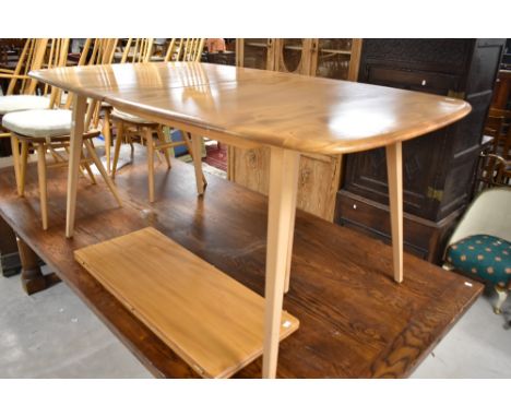 A light stain Ercol extending dining table on typical splay legs, approx. 153 x 91cm, plus addition bifold leaf (extending by
