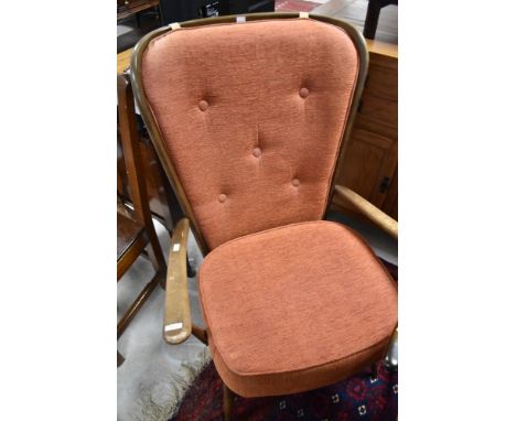 An Ercol easy chair and three carvers, two having fleur de lys pattern