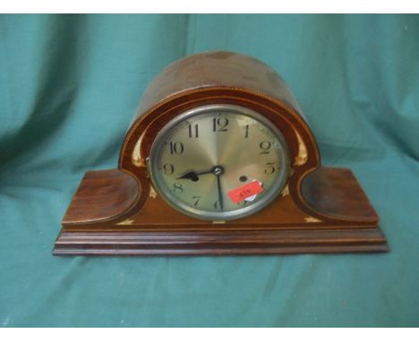 An attractive Westminster styled clock inlaid in various woods and mother of pearl