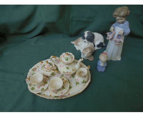 Delightful small ceramic child's tea set to include tray, 2 cups and saucers, sugar, milk and teapot, Lladro and Nao figures