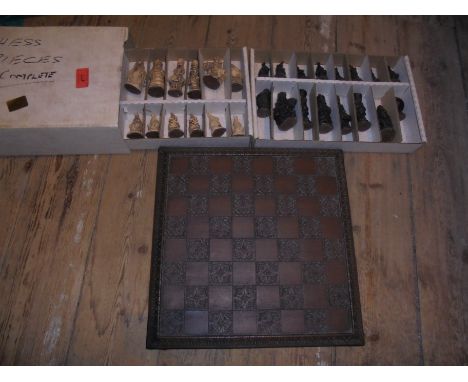 Box of wooden Chess pieces being animals, together with chessboard