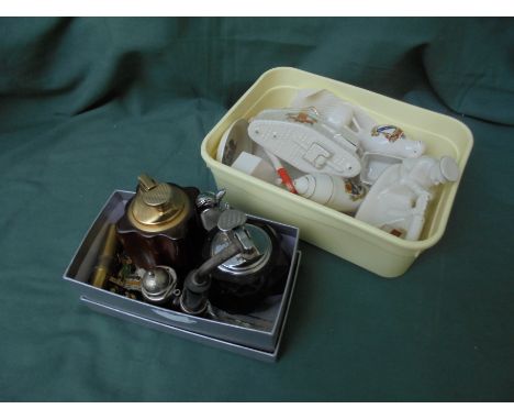 A mixed box of Goss styled ornaments stating various towns together and separate box of table lighters, badges and pipe