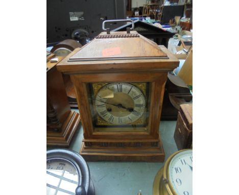 Large wooden mantel clock, brass face, Roman Numerals