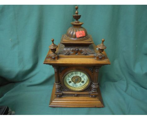 Ornate mantel clock, highly decorative with gold and enamel face