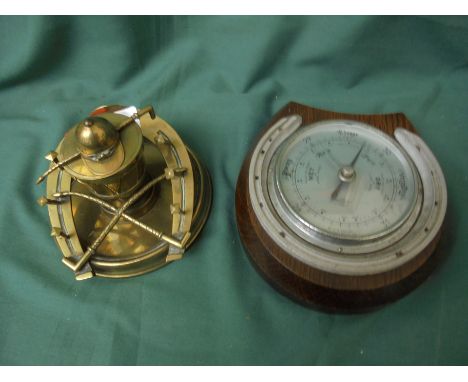 Super brass desk inkwell with jockey cap on lid opener and original porcelain ink well together with a wall-mounted barometer
