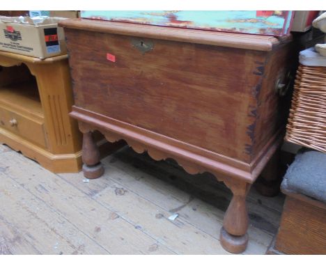 Old pine trunk with brass handles on later stand