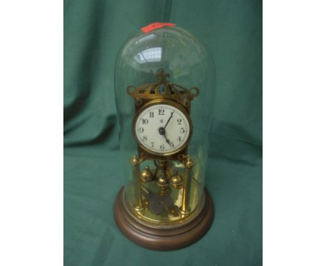 Glass domed table clock in brass on metal style base possible 1930's