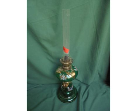 Green glass oil lamp with gold and floral decoration including funnel