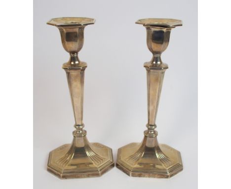 A pair of silver candlesticks by William Hutton & Sons Limited, London 1902, with removable drip pans the tapering rectangula