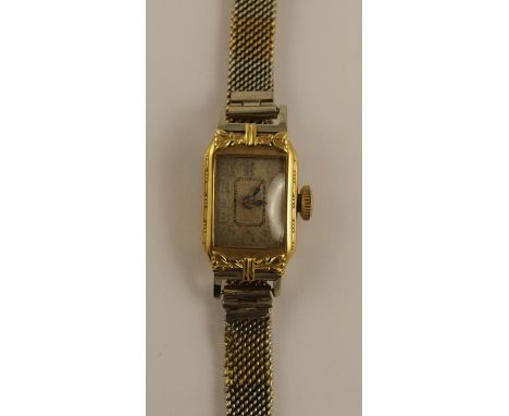 An 18ct vintage ladies watch with a 9ct bi-colour mesh strap, total weight including mechanism approx 16gms