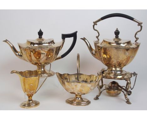 A four piece silver tea service including kettle on stand, by Mappin & Webb, Sheffield 1925, of tapering oval shape with lobe