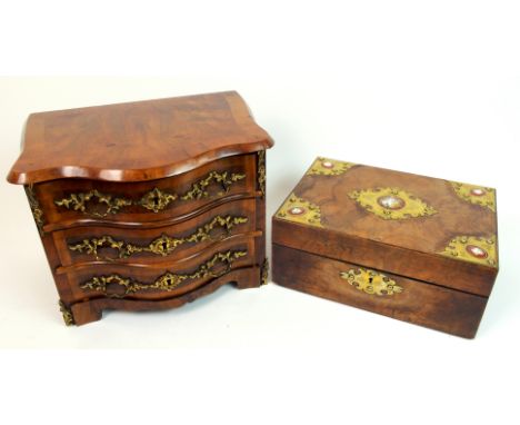 An Edwardian bow front miniature chest of drawers the three drawer chest decorated with rococo gilded brass handles and lock 