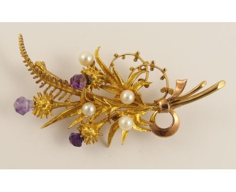 A Scottish river pearl and amethyst set brooch retailed by Cairncross of Perth, the floral brooch depicting thistles set with