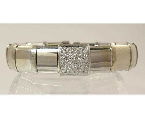 An 18ct white gold diamond set bangle of expandable torc style, diamond content approximately 0.36cts, approximate weight 50.