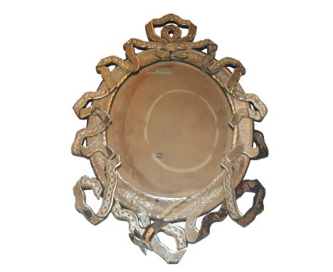 A Continental oval wall mirror with ribbon tied and acid etched mirrored surround (damages), 140cm high x 37cm wide