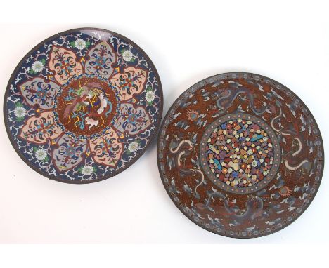 A cloisonne enamel plaque decorated with Ho-o within formal foliate panels, 30.5cm diameter and another with dragons surround