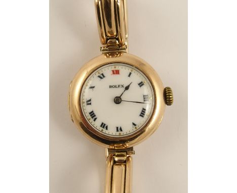 A 9ct ladies vintage Rolex with expanding strap, the white enamelled dial with both red and black Roman numerals