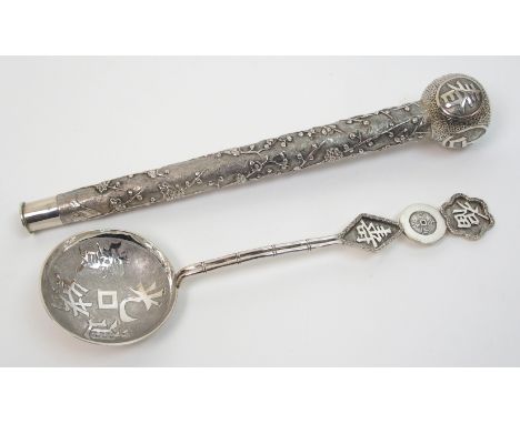 A Chinese silver parasol handle decorated with blossom and calligraphy, 24cm long, 3oz and a serving spoon decorated with cal